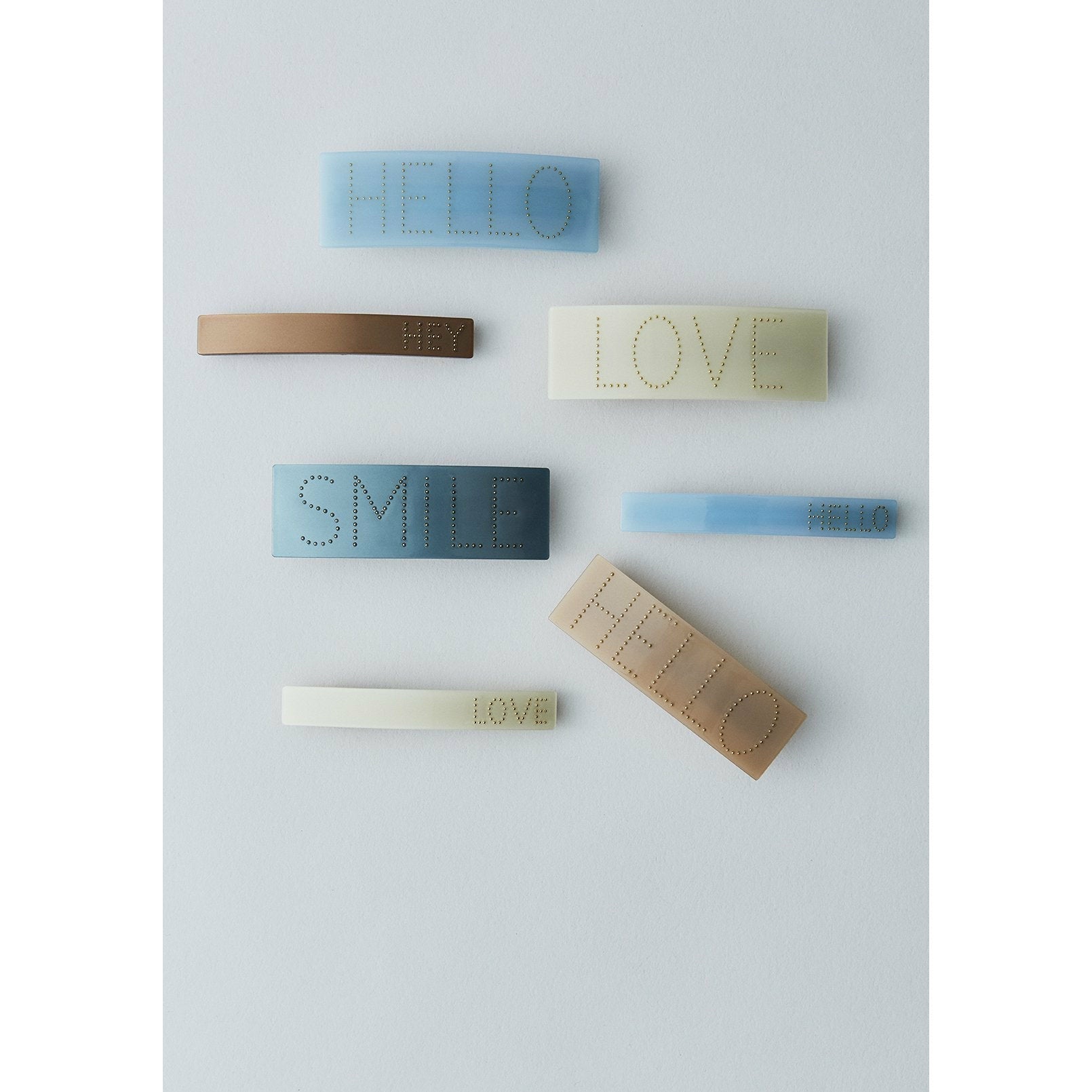 DESIGN LETTERS Ikonisk hårklip, hop, blå